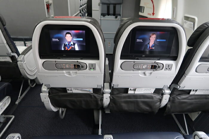 two seats with screens on each side