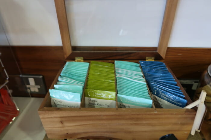 a wooden box with tea bags in it