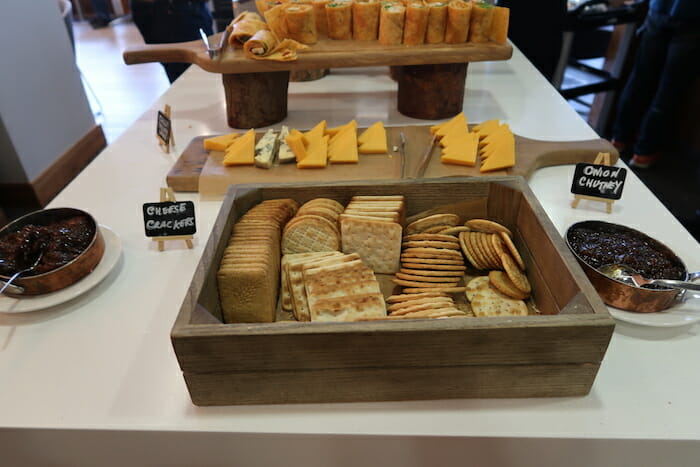 a tray of crackers and cheese on a table