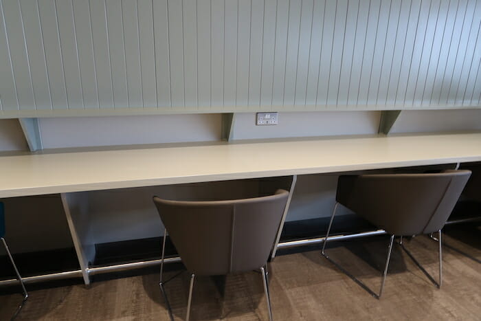 a white table with brown chairs