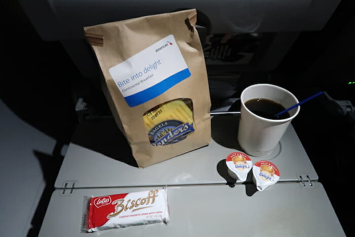 a bag of food and a cup of coffee