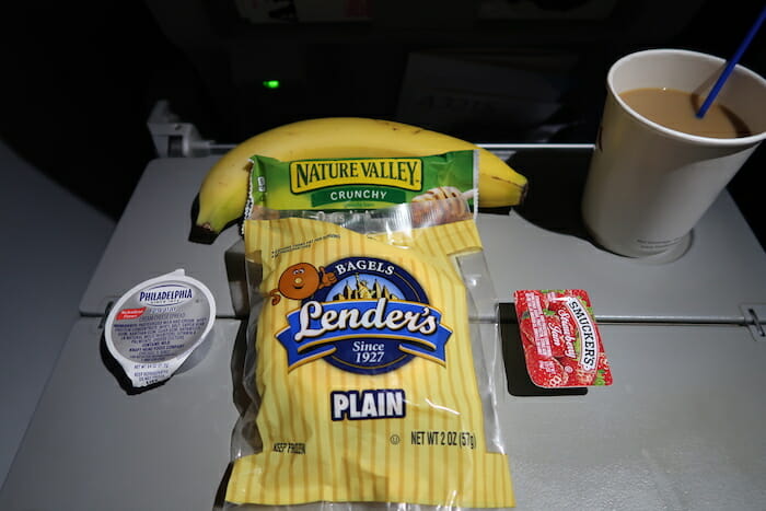 a banana and a bag of chips on a table