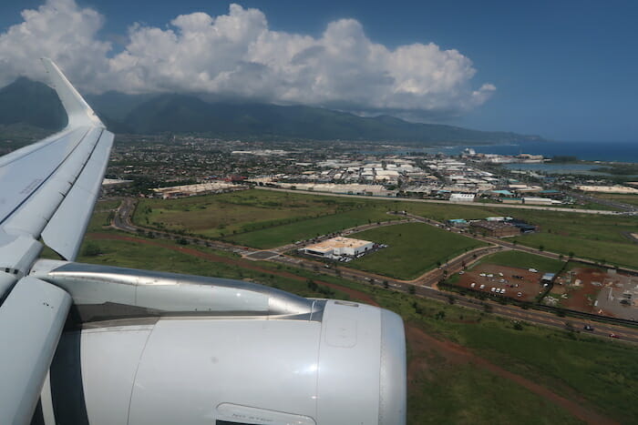 an airplane wing and a city