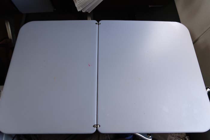 a white rectangular object with a metal frame