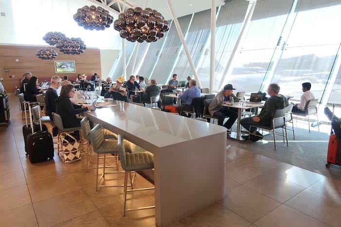 a group of people sitting at tables in a room