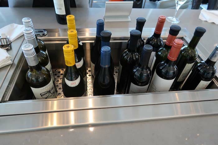 a group of wine bottles in a metal container