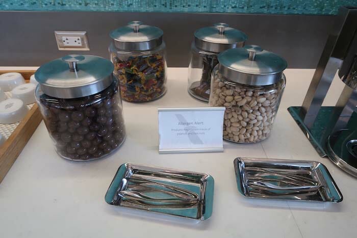 a group of glass jars with food in them