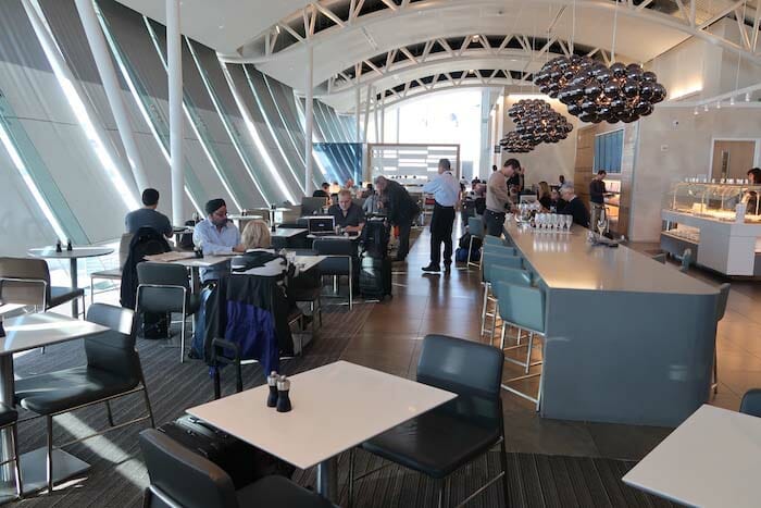 a group of people sitting at tables in a room