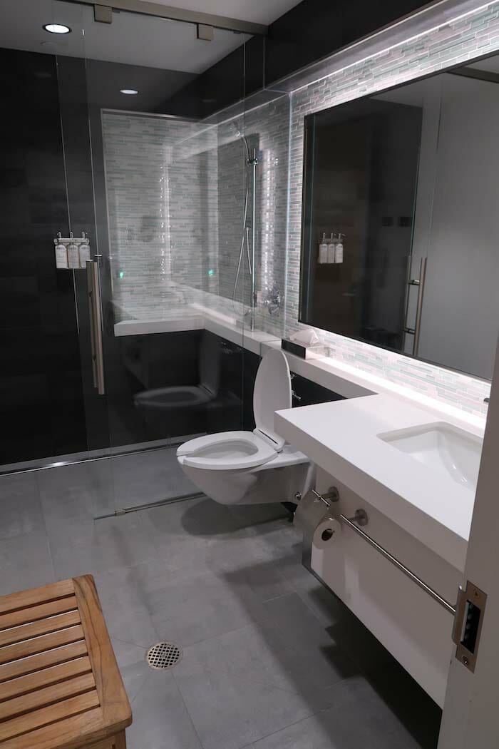 a bathroom with a glass shower door