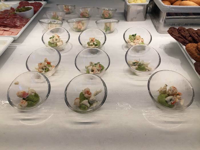 a group of small bowls of food