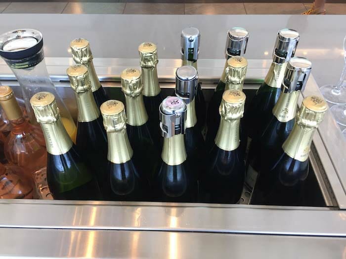 a group of bottles of champagne