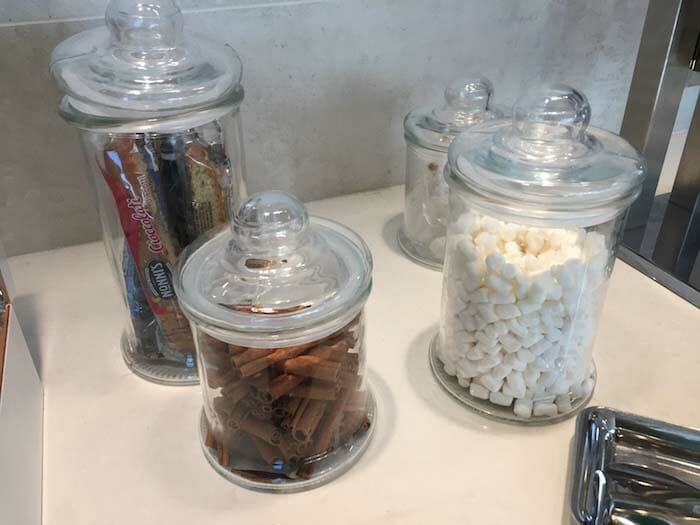 a group of glass jars with different types of objects