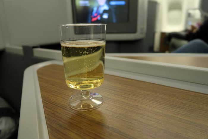 a glass of liquid on a table