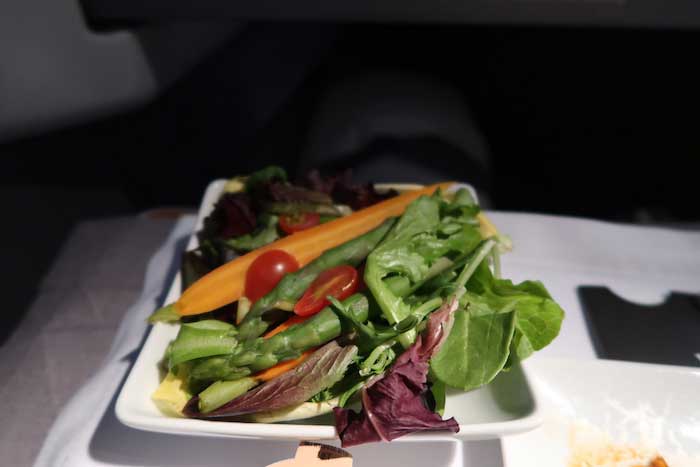 a plate of salad on a table