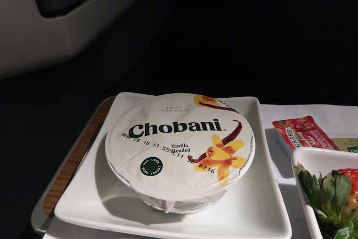 a container of yogurt on a plate