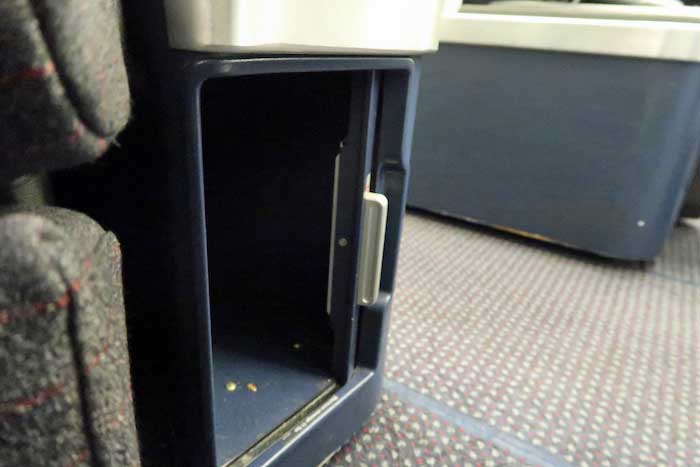 a small open drawer on a plane