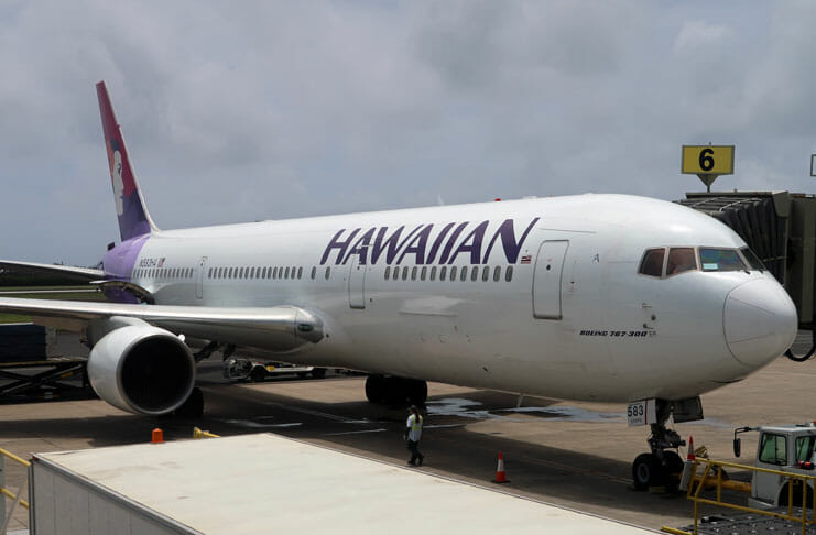 a large white airplane on a runway