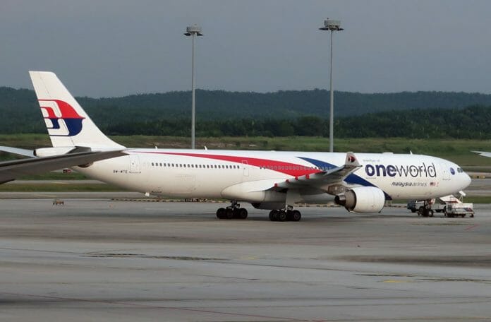 a white airplane on a runway