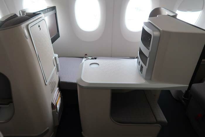 a seat and a table in an airplane