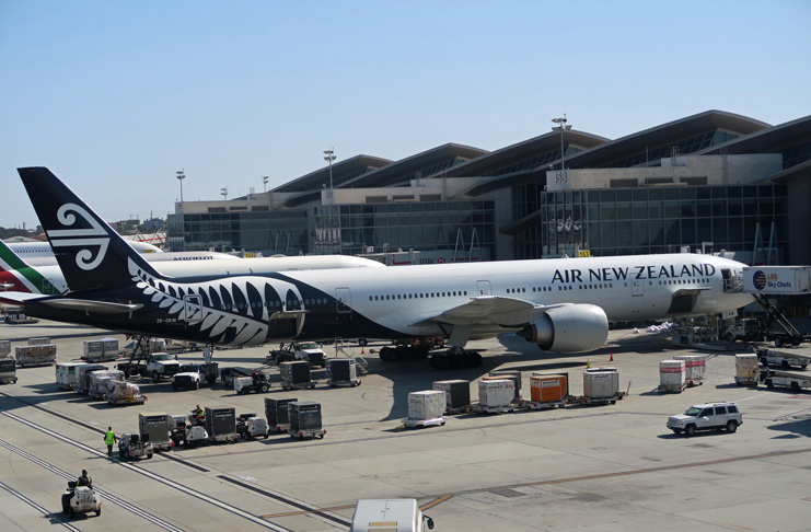a large white airplane with black and white design on it