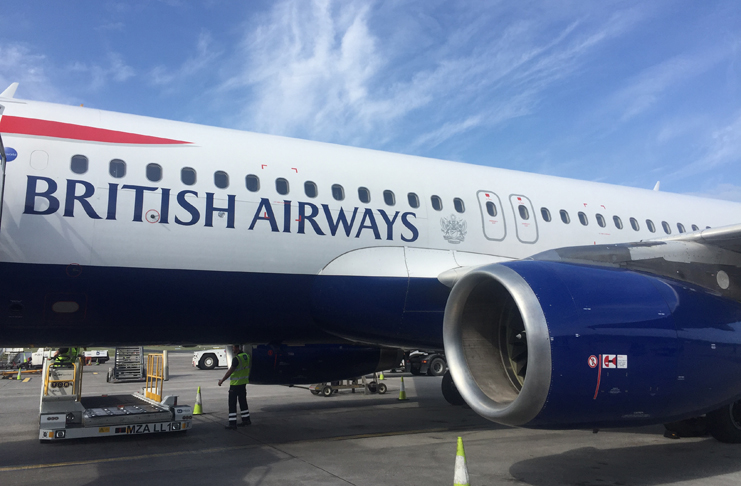 a large airplane with blue writing on it