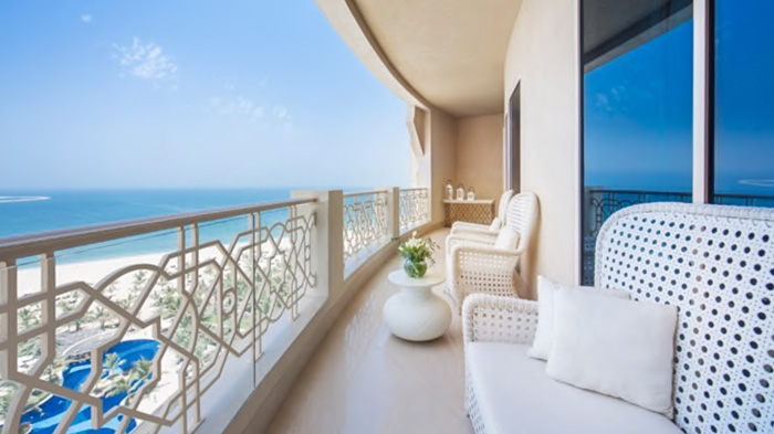 a balcony with a view of the ocean