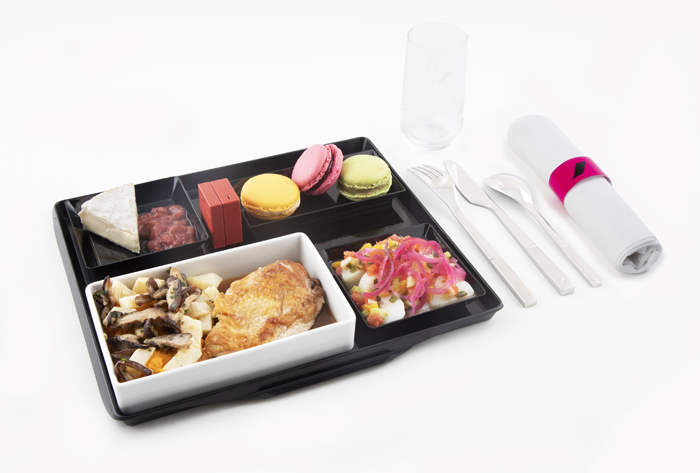a tray of food and utensils
