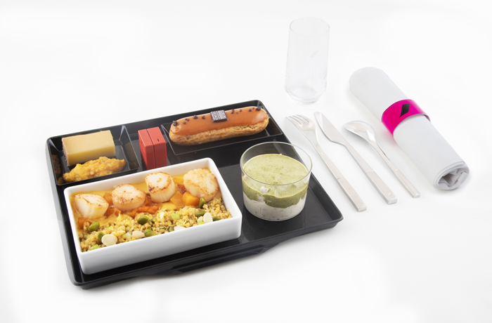 a tray with food and utensils