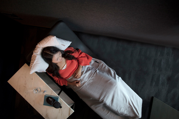 a woman lying on a bed