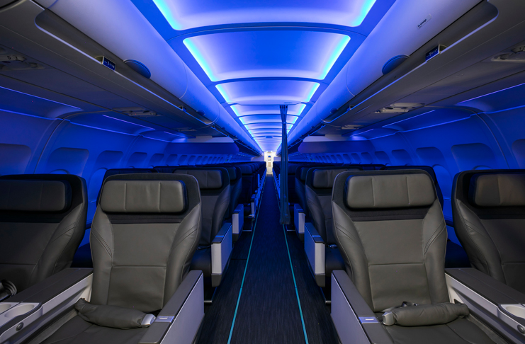 the inside of an airplane with blue lights