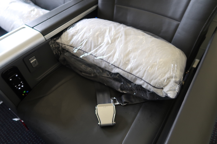 a pillow in a plastic bag on a seat