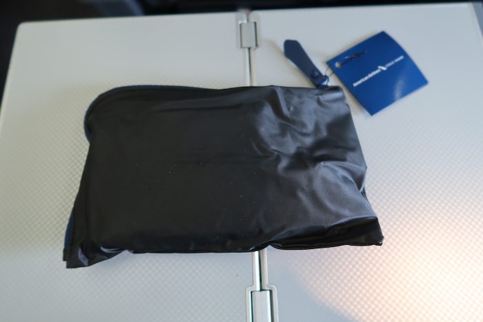 a black pouch on a white surface