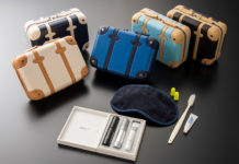 a group of small suitcases and a sleeping mask