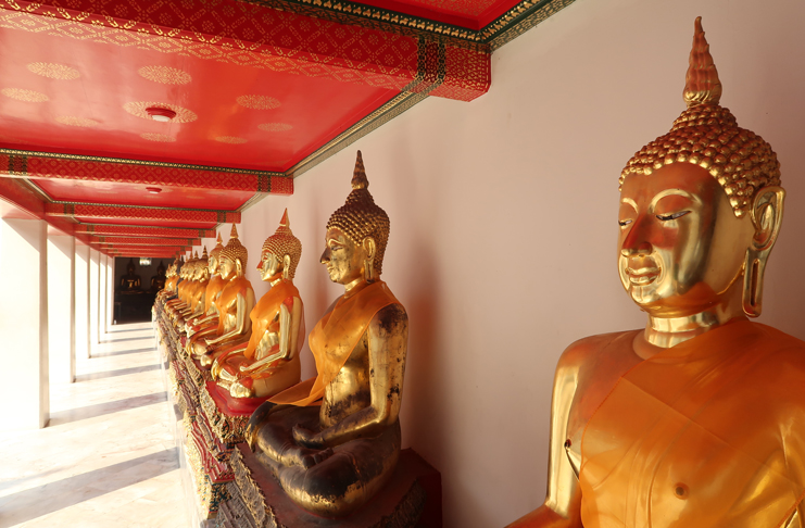 a row of gold statues