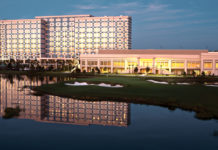 a building next to a lake