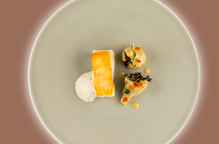 a plate of food on a white surface