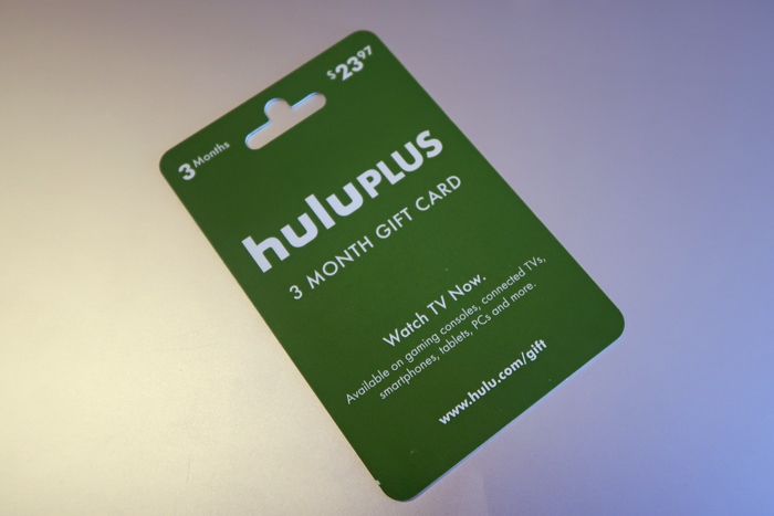 a green gift card with white text