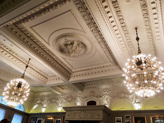 a ceiling with chandeliers and a decorative ceiling