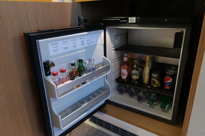 a mini fridge with drinks inside