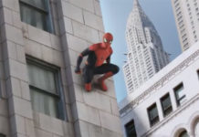 a man in a garment climbing a building