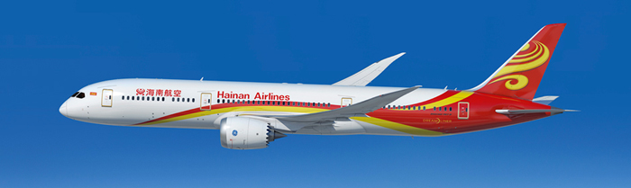 a white airplane with red and yellow stripes