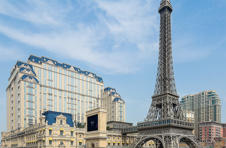 a large metal tower in a city