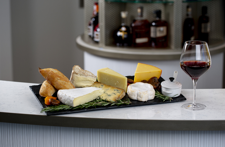 a plate of cheese and bread on a counter