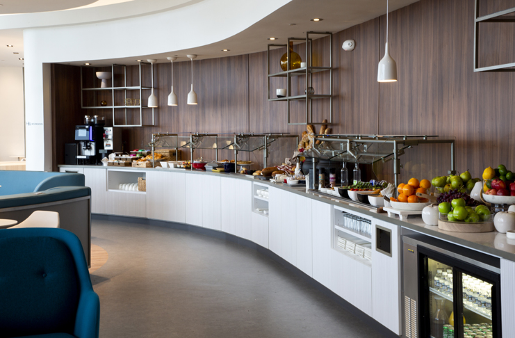 a buffet line with food on the counter