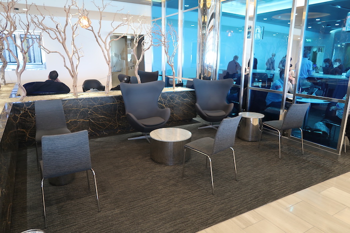 a group of chairs and a table in a lobby