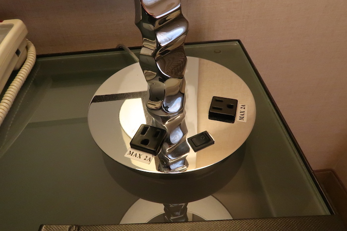 a metal sculpture on a glass table
