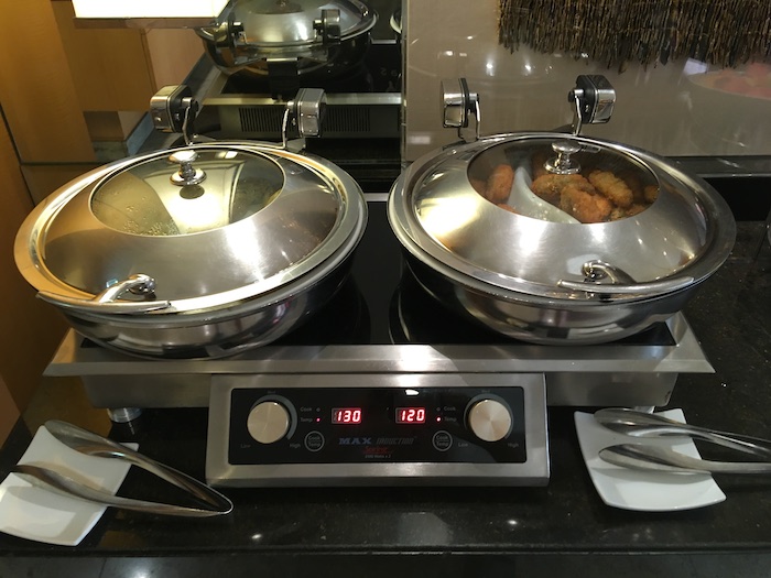 a two pans on a stove