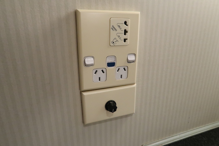 a wall outlet with switches and switches