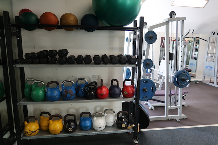 a shelf with weights and weights on it