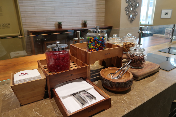 a counter with candy and utensils